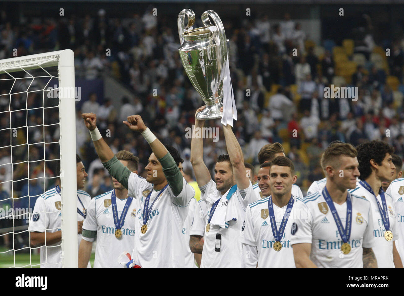 Kiev, Ukraine. 27th May, 2018. Real Madrid players celebrate with the trophy after winning the UEFA Champions League final soccer match Real Madrid vs Liverpool FC, at the NSC Olimpiyskiy stadium in Kiev on 26 May 2018. Credit: Serg Glovny/ZUMA Wire/Alamy Live News Stock Photo