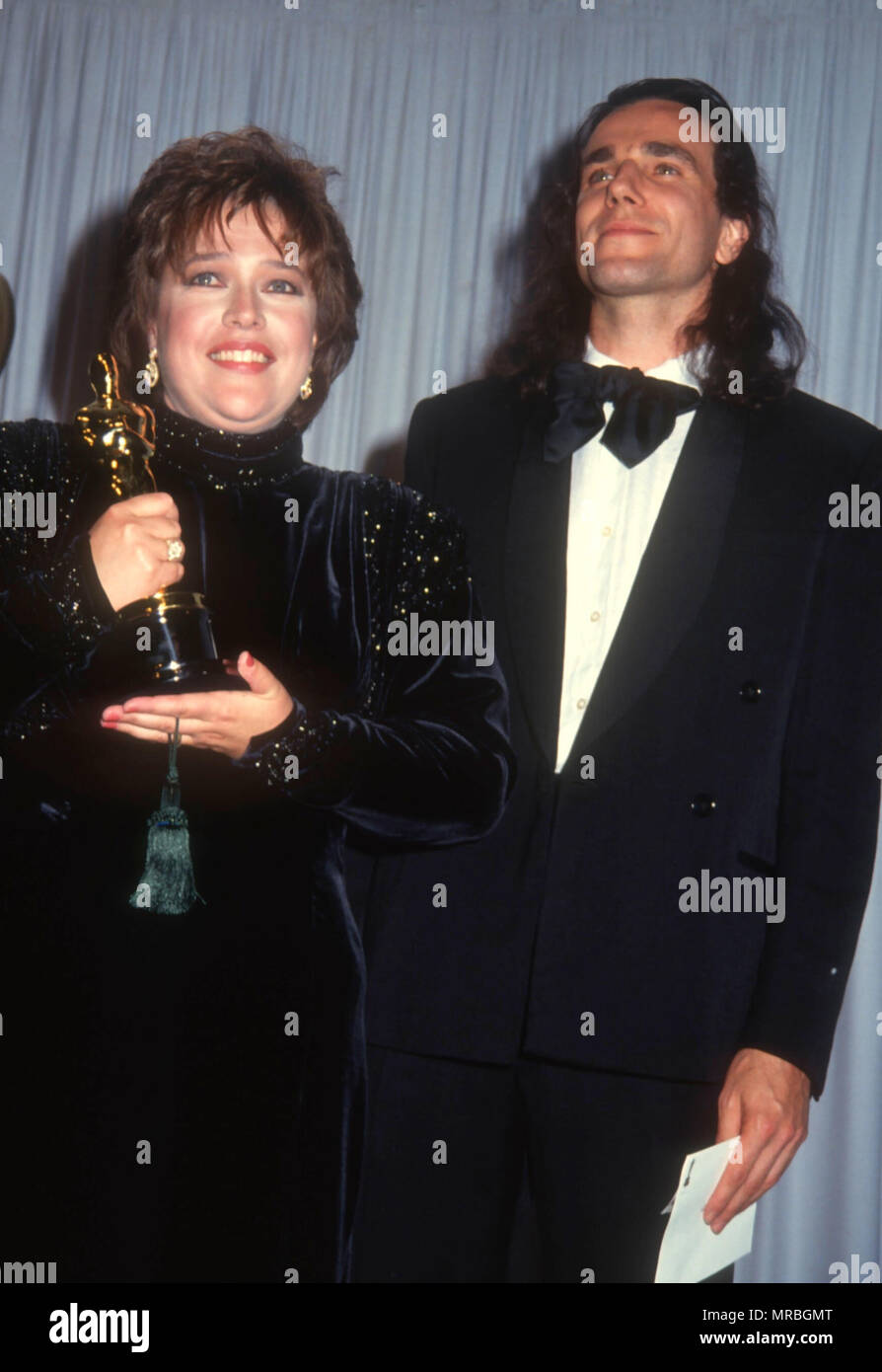 LOS ANGELES, CA - MARCH 25: (L-R) Actress Kathy Bates and actor Daniel Day  Lewis attend the 63rd Annual Academy Awards on March 25, 1991 at Shrine  Auditorium in Los Angeles, California.