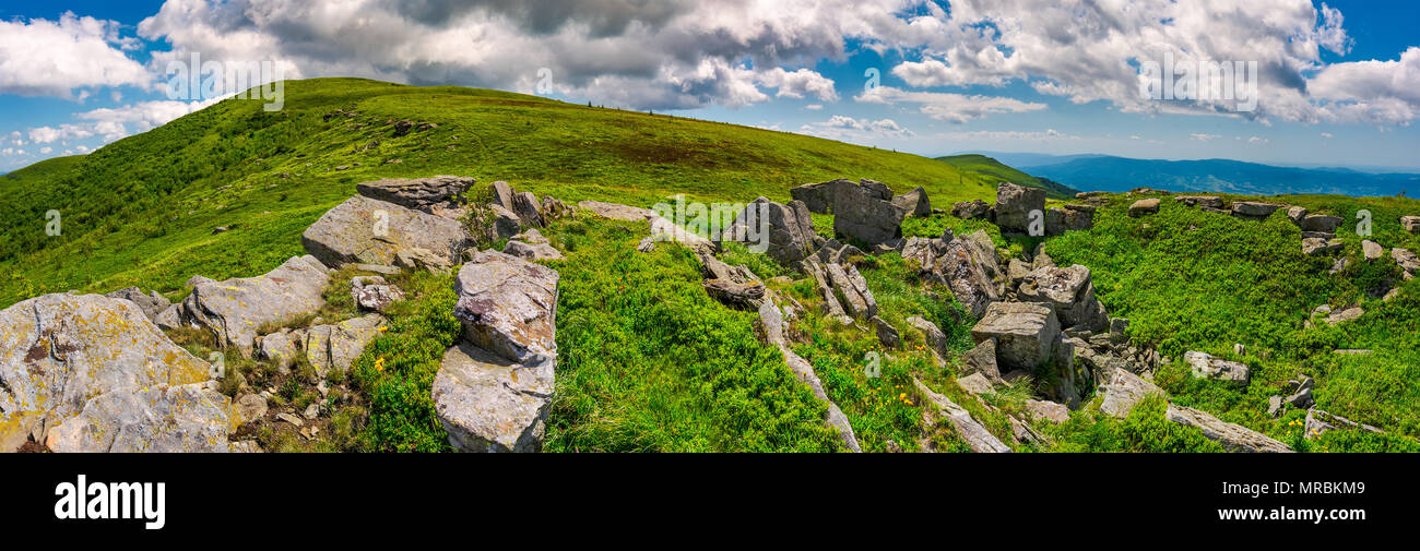 panorama of Runa mountain with rocks on hillside. gorgeous landscape of amazing Carpathian mountains on a summer day with beautiful cloudscape on a bl Stock Photo