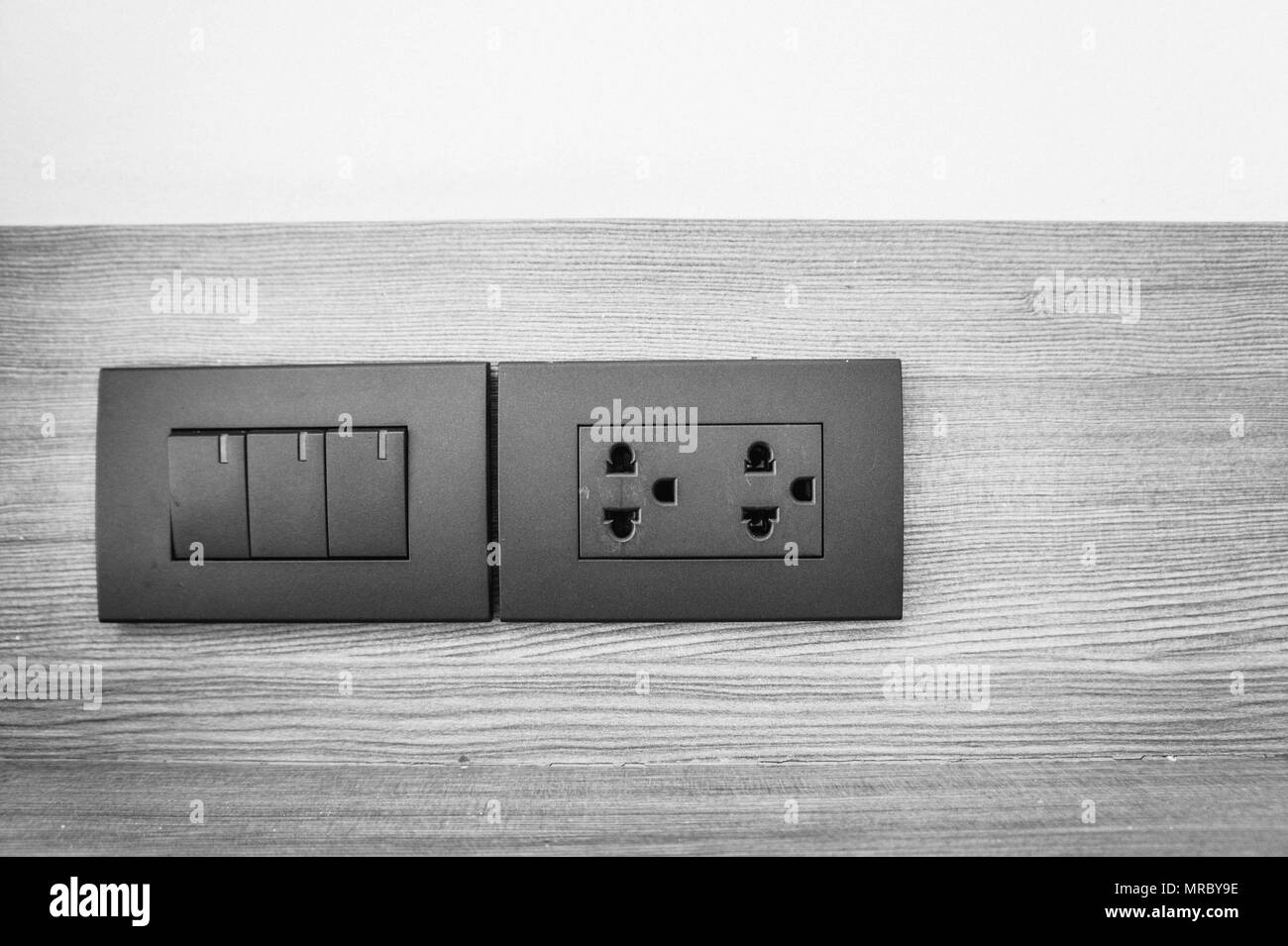 outlet switch on wall in home ,Equipment that connects electrical signals to various home appliances. Stock Photo