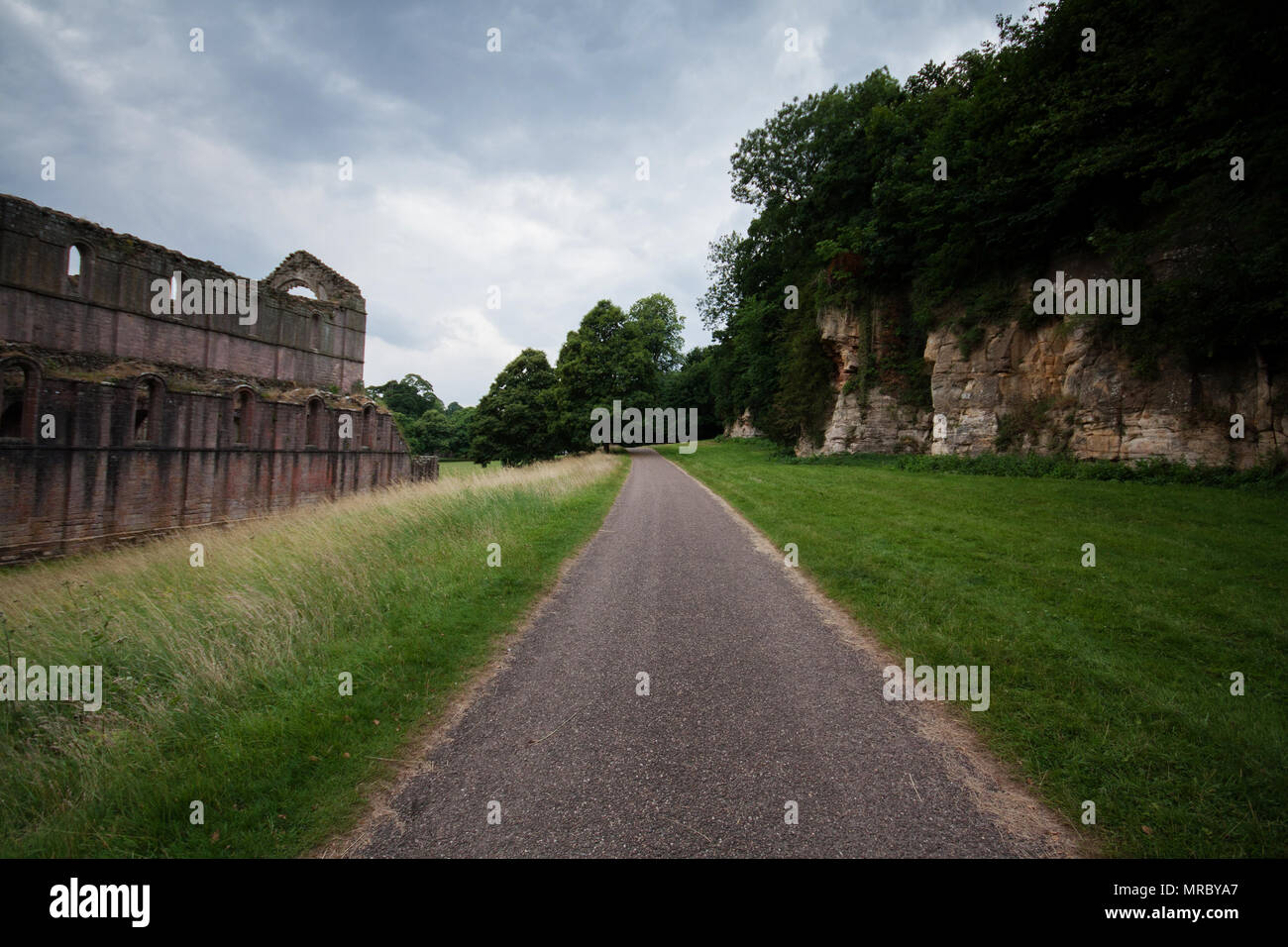 Paved walking path in Fountains Abbey, Ripon, UK Stock Photo