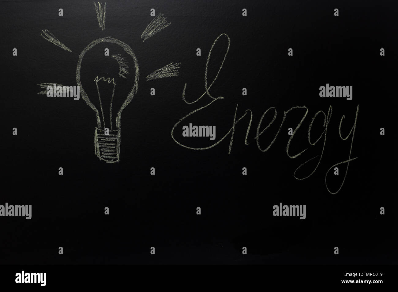 drawn light on blackboard with the text: Energy Stock Photo