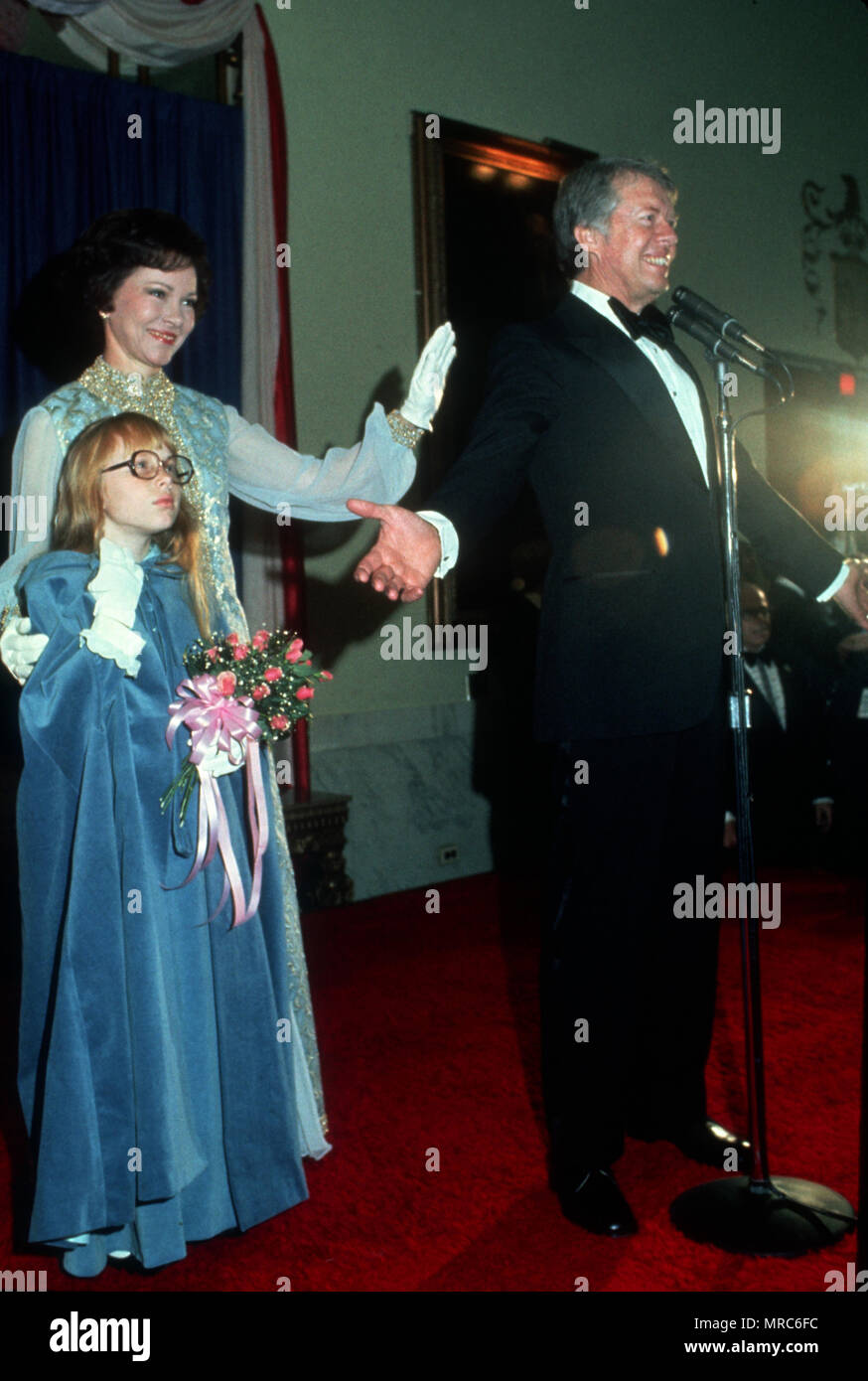 Washington, DC 1977/01/20 President Jimmy Carter and Rosslyn and Amy Carter at an Inaugural Ball at the Mayflower Hotel on the night of the Carter inauguration, January 20, 1977. Photo byDennis Brack B 1 Stock Photo