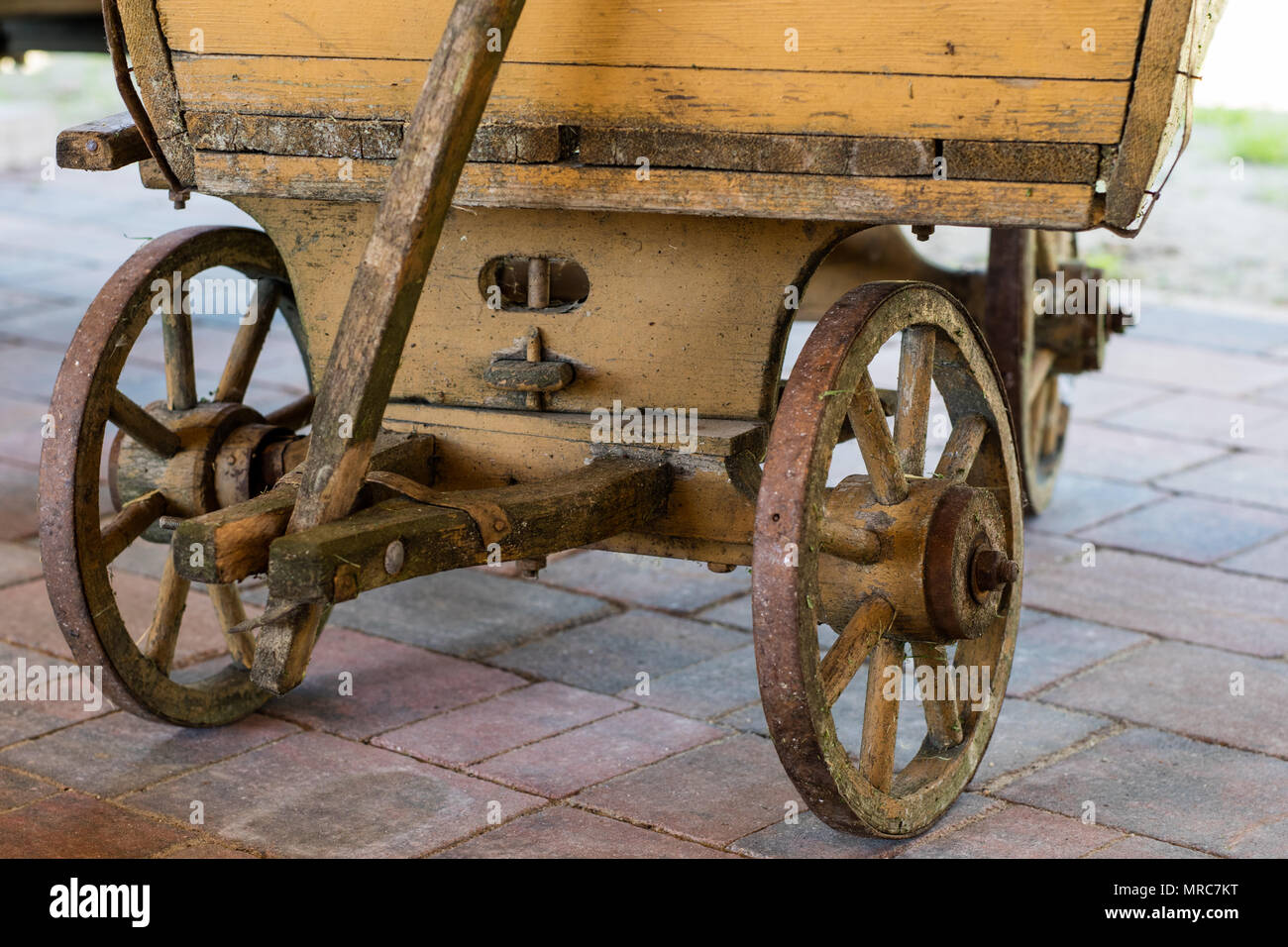 Old wooden wheels for horse cart. Openair museum where various types of cars and wheels are