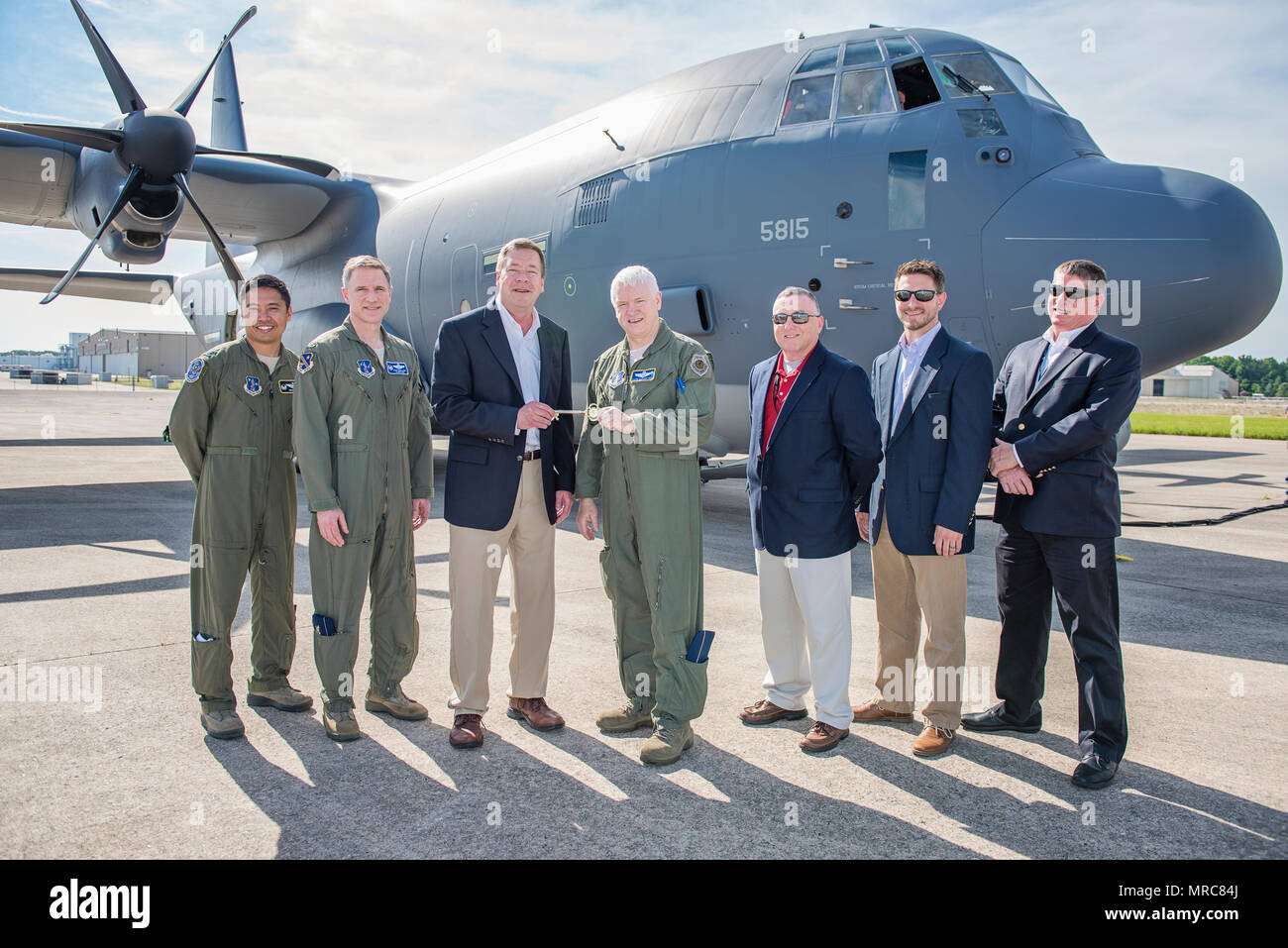 Lt. Gen. L. Scott Rice, director of the Air National Guard, along with  members of Lockheed Martin and the 176th Wing, Alaska Air National Guard,  pose for a photo in front of
