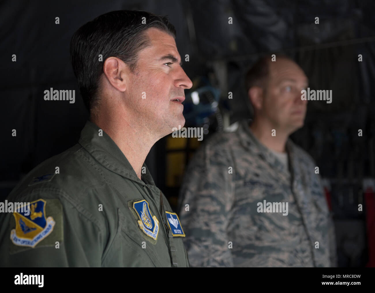 Col. Robert L. Dotson, 374th Operations commander, receives a briefing before his fine flight, June 2, 2017, at Yokota Air Base, Japan. Fini flights follow an Air Force tradition where aircrew members are met and hosed down with water by their group comrades. (U.S. Air Force photo by Airman 1st Class Juan Torres) Stock Photo
