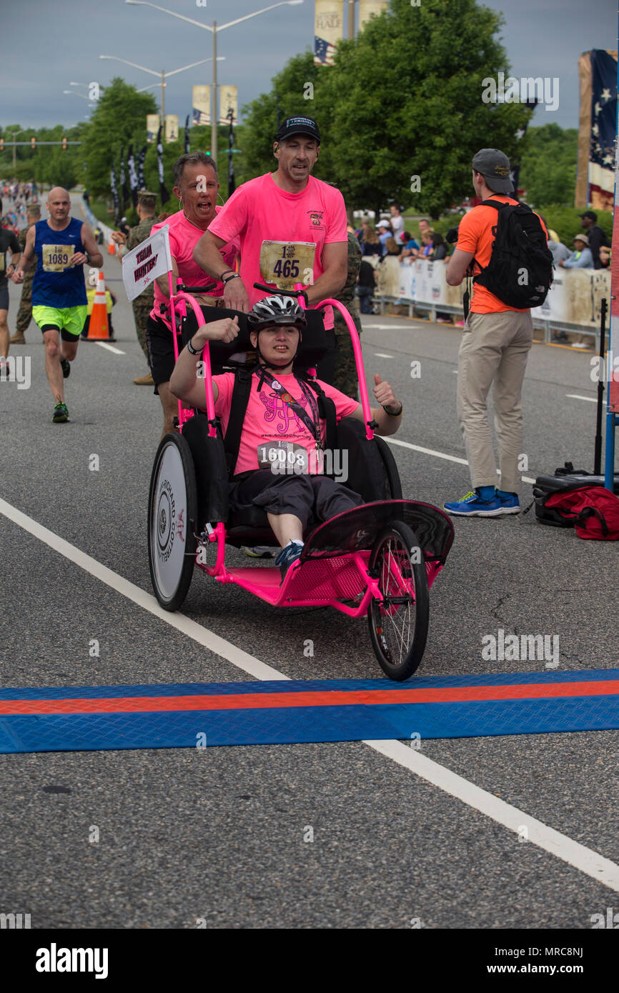 Chris Chalkley, right, pushes a stroller with Benjamin Tritt, left