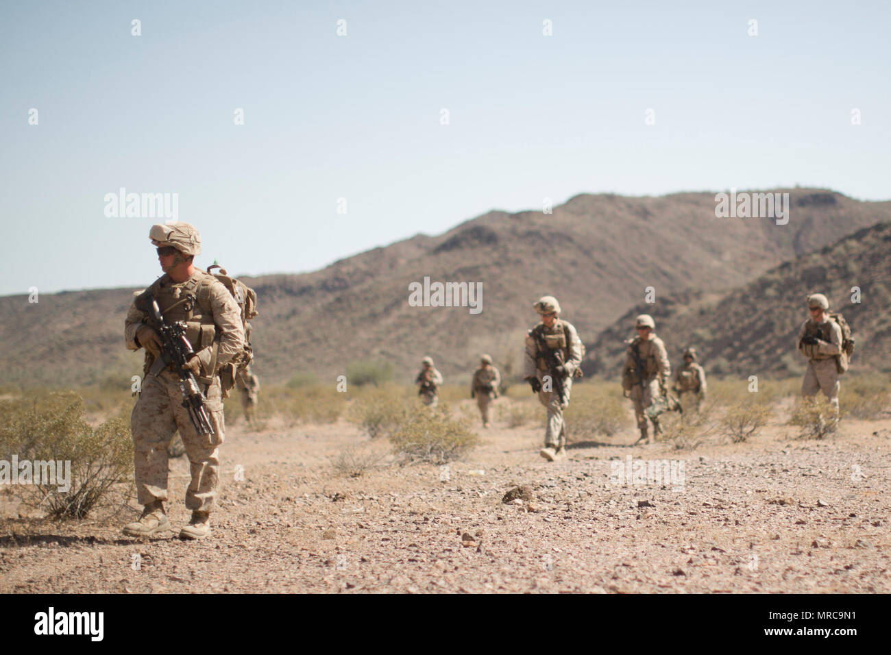 U.S. Marines with 2nd Battalion, 6th Marine Regiment, 2nd Marine Division secure the landing zone during a Marine expeditionary unit exercise (MEUEX) in support of Weapons and Tactics Instructor course (WTI) 2-17 at East Tactical Airfield, Ariz., April 14, 2017. The MEUEX was designed to focus on airfield seizure operations and integration with a ground combat element with the intent to focus on MEU capabilities to seize a foothold in the littorals in a denied operating area using range on a simulated ship. WTI is a seven-week training event hosted by Marine Aviation Weapons and Tactics Squadr Stock Photo