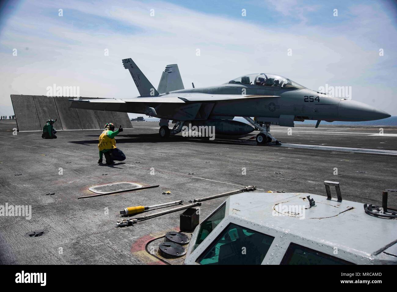 170601-N-KJ380-241  ATLANTIC OCEAN (June 1, 2017) Aviation Boatswain's Mate (Equipment) 2nd Class Ladarrius Robinson signals an F/A-18E Super Hornet assigned to the Gladiators of Strike Fighter Squadron (VFA) 106 for launch on the flight deck of the aircraft carrier USS Dwight D. Eisenhower (CVN 69) (Ike). Ike is currently conducting aircraft carrier qualifications during the sustainment phase of the Optimized Fleet Response Plan (OFRP). (U.S. Navy photo by Mass Communication Specialist Seaman Neo B. Greene III) Stock Photo