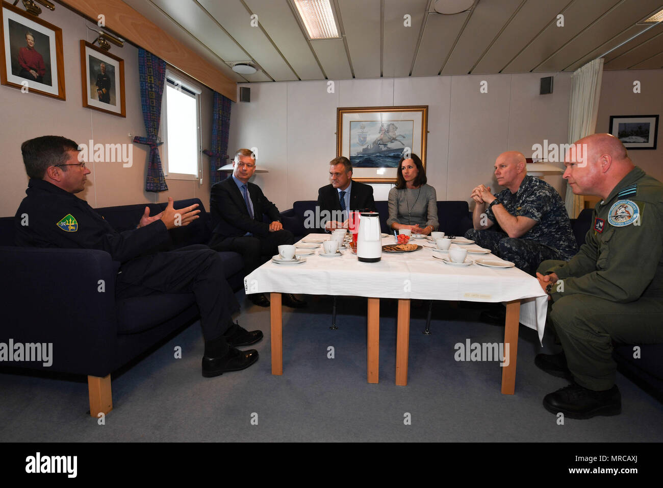 170603-N-JI086-362 - SZCZECIN, Poland (June 3, 2017) United Kingdom Rear Adm. Paddy McAlpine, Deputy Commander, Naval Striking and Support Forces NATO, right, gives remarks during an office call with the Governor of Szczecin aboard the Danish Absalon-class combat support ship HDMS Absalon (L16), June 3, 2017. BALTOPS is an annual U.S.-led, Naval Striking and Support Forces NATO-executed, multinational maritime exercise in the Baltic Sea region designed to enhance flexibility and interoperability among its participants. (U.S. Navy photo by Mass Communication Specialist 3rd Class Ford Williams/R Stock Photo
