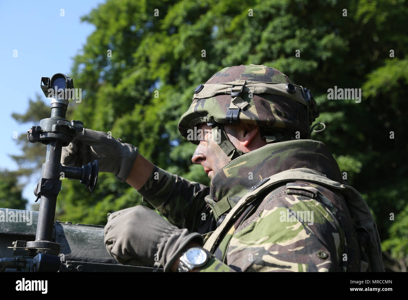 A Romanian soldier of Alpha company, 811th Infantry Battalion adjusts the scope of a M85 A425 152mm howitzer while conducting a fire mission during Exercise Combined Resolve VIII at the Hohenfels Training Area, Hohenfels, Germany June 2, 2017. Exercise Combined Resolve VIII is a multinational exercise designed to train the Army’s Regionally Allocated Forces to the U.S. European Command. Combined Resolve VIII will include more than 3,400 participants from 10 nations. The goal of the exercise is to prepare forces in Europe to operate together to promote stability and security in the region. (U.S Stock Photo