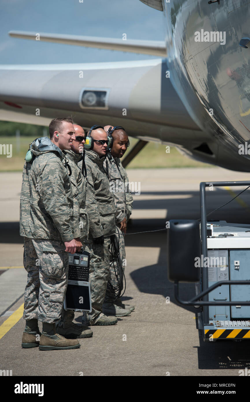 Maintenance Airmen from the 513th Air Control Group watch as an aircraft tow vehicle connects with a U.S. Air Force E-3 Sentry on June 7, 2017, at NATO Air Base Geilenkirchen, Germany. The 513th is providing airborne command and control to BALTOPS 2017, an exercise that involves 50 ships and submarines and 40 aircraft from 14 member nations. (U.S. Air Force photo/2nd Lt. Caleb Wanzer) Stock Photo