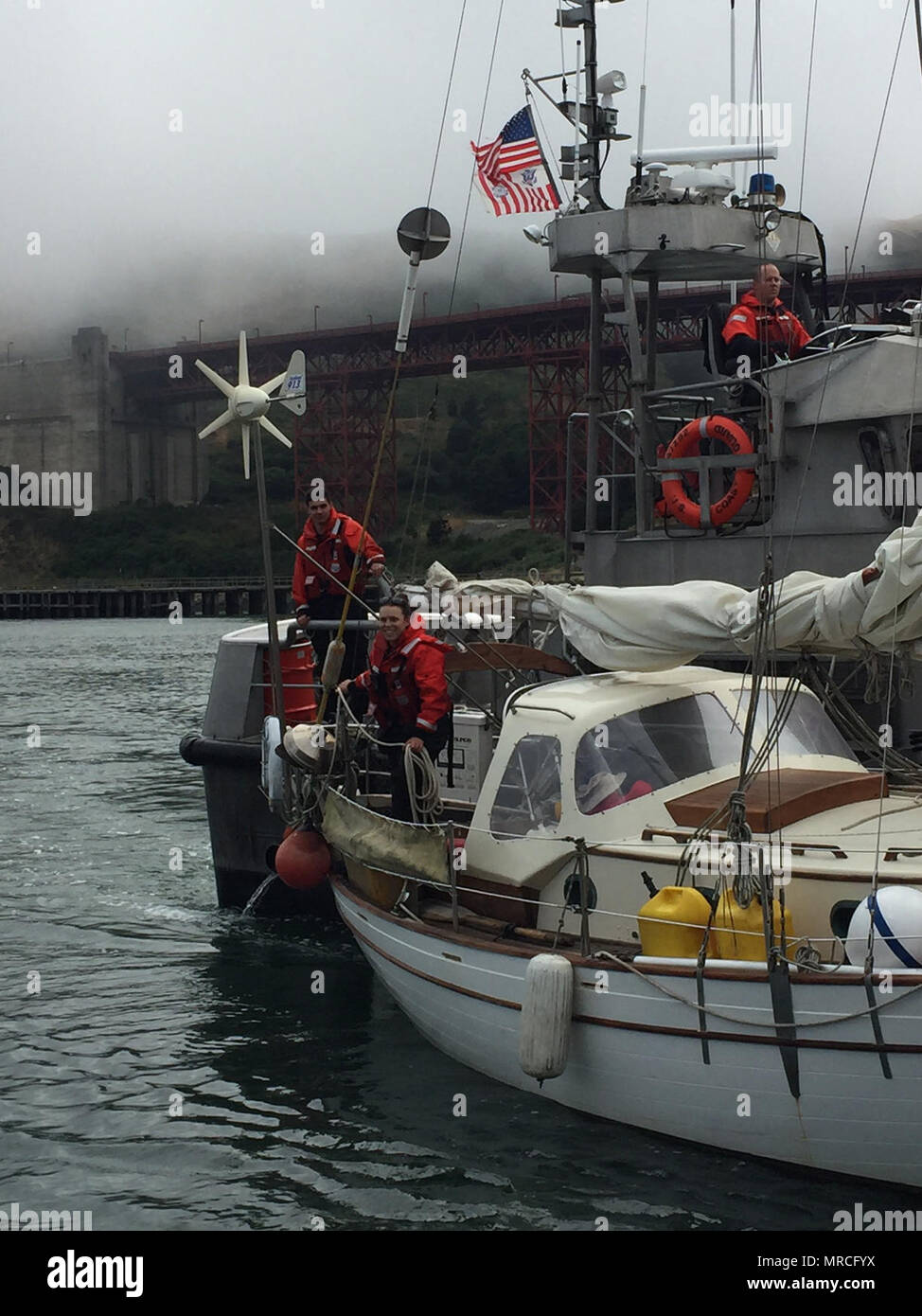 A Coast Guard boat crew from Station Golden Gate assists a boater on a