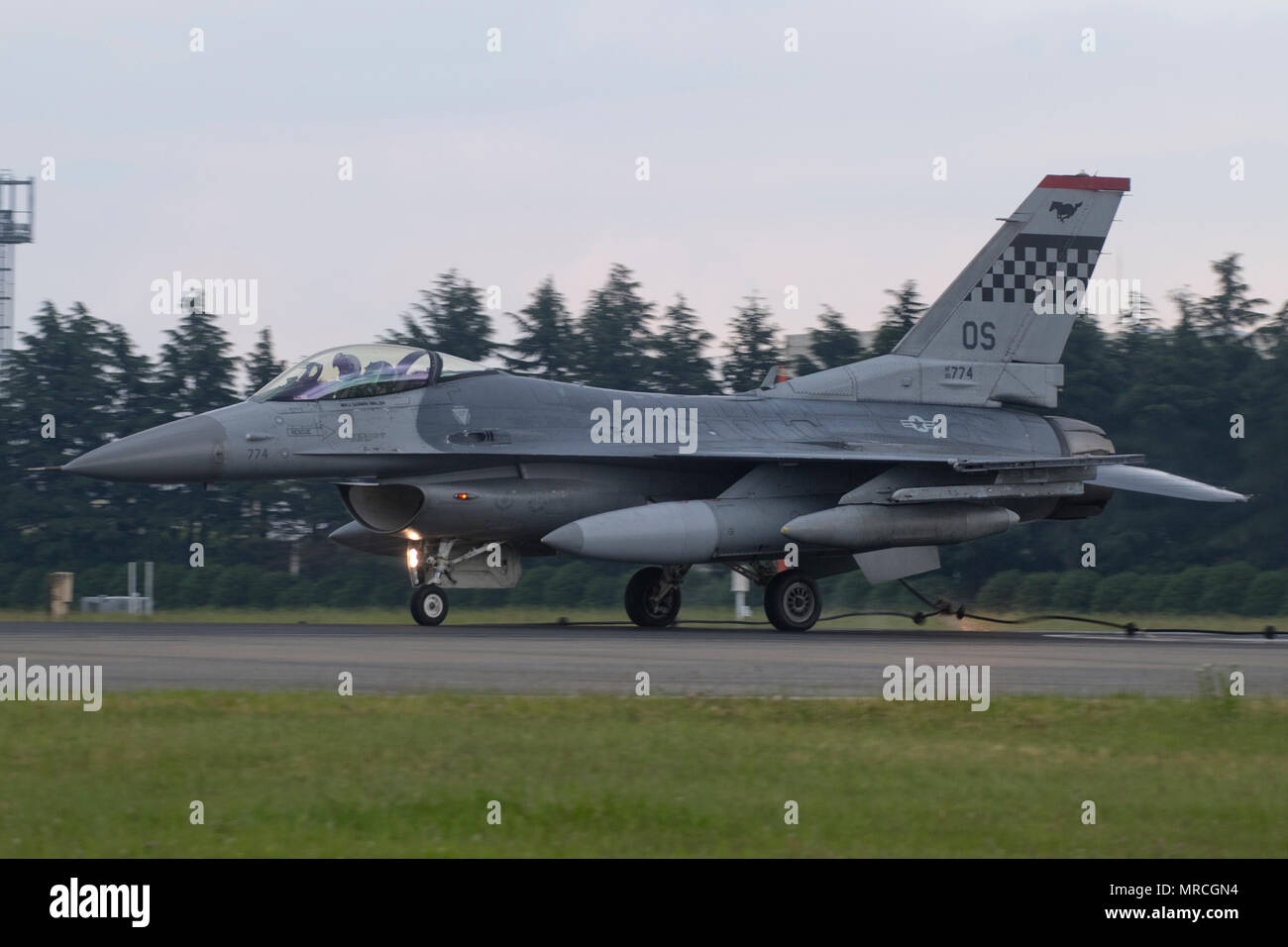 An F-16 Fighting falcon assigned to the 36th Fighter Squadron, Osan Air Base, engages a barrier during an annual certification test of the Aircraft Arresting System at Yokota Air Base, Japan, June 1, 2017. Airmen from the 374 CES and 374th Operations Support Squadron are responsible for setting up the system and logging any deficiencies during the test. (U.S. Air Force photo by Yasuo Osakabe) Stock Photo