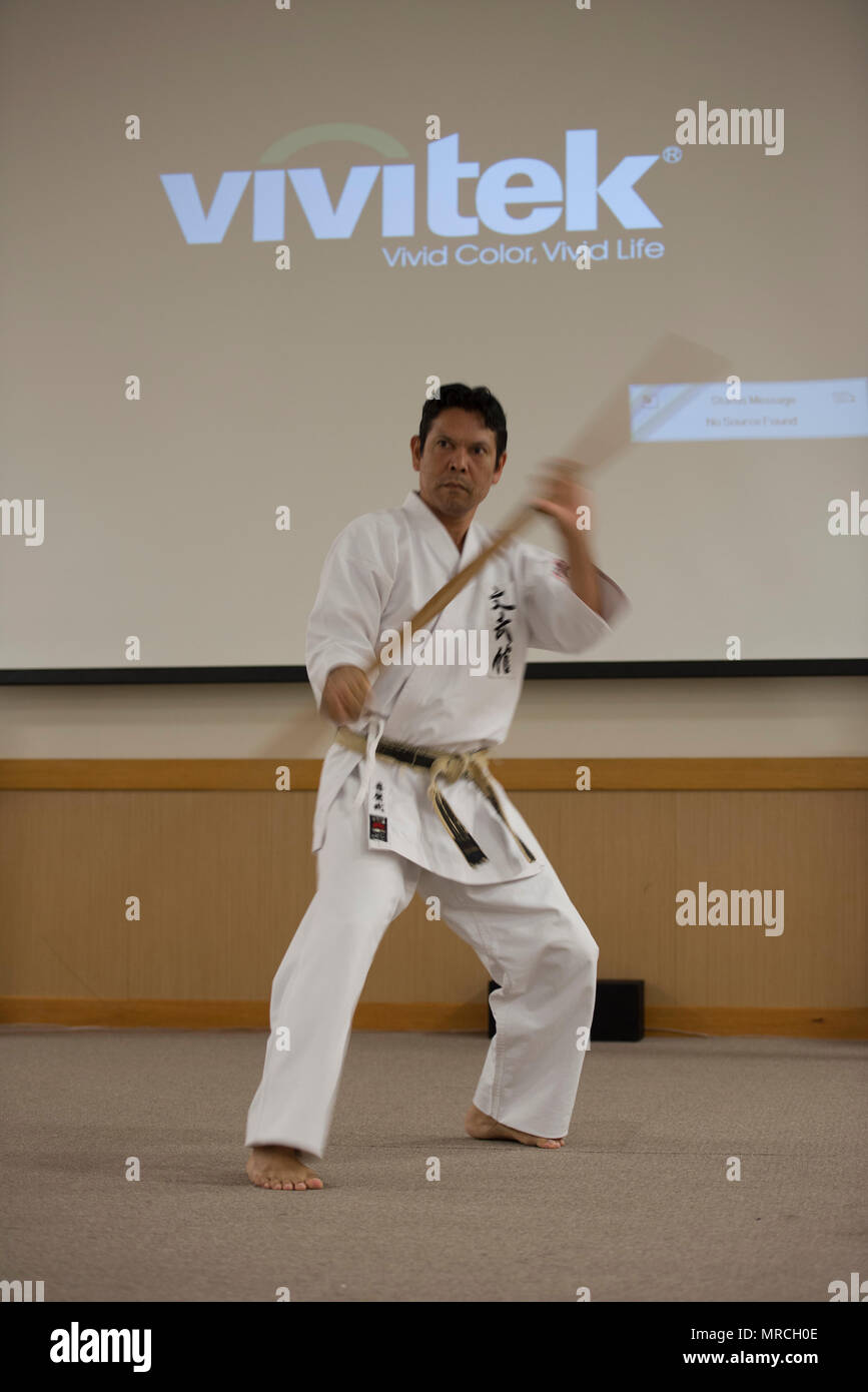 An Okinawa Kobudo instructor demonstrates Kobudo selfdefense