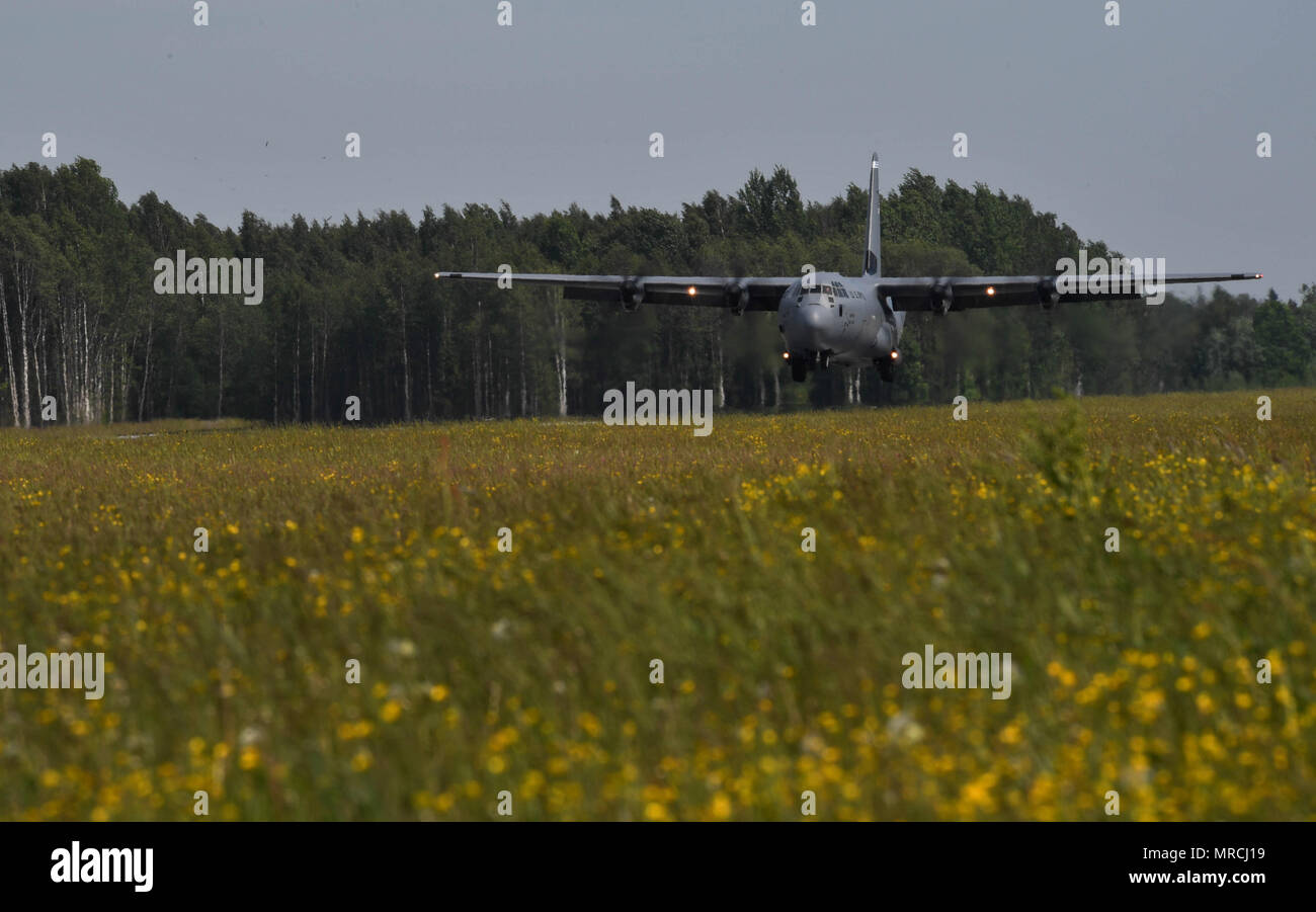 A U.S. Air Force C-130J Super Hercules lands on a runway during exercise Saber Strike 17 on Lielvārde Air Base, Latvia, June 7, 2017. U.S. military members are working alongside their NATO partners throughout the exercise in the Baltic region and Poland. Saber Strike 17 continues to increase participating nations’ capacity to conduct a full spectrum of military operations. (U.S. Air Force photo by Senior Airman Tryphena Mayhugh) Stock Photo
