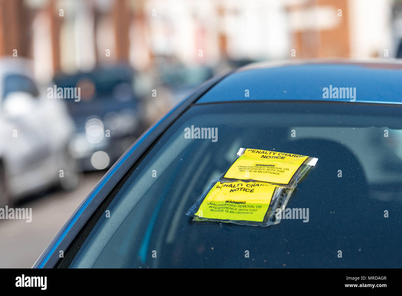Penalty Charge Notice on Car Windscreen parked on British road in England. Stock Photo