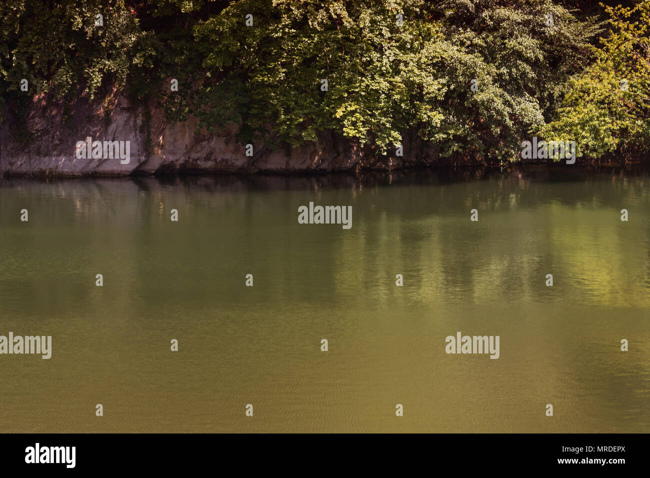 Lake with banks on the site of a former quarry for the extraction of