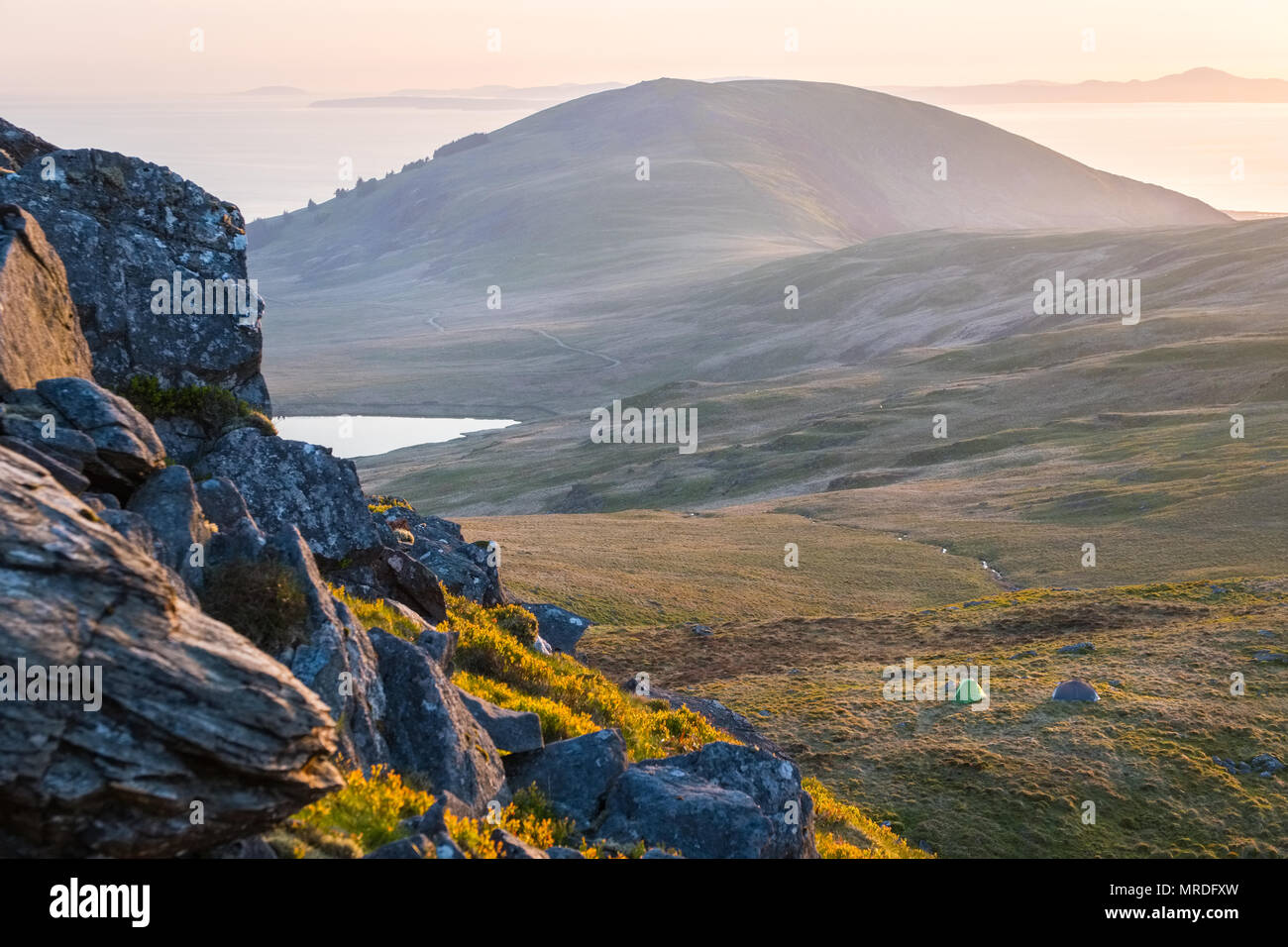 tent pitched on a Welsh mountain during a wild camping trip in the ...