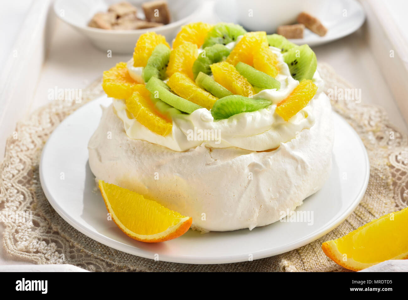 Delicious Pavlova Meringue Cake With Kiwi Orange Slices And