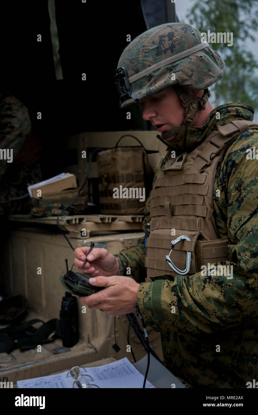 A U.S. Marine with Black Sea Rotational Force 17.1 plots points during Exercise Saber Strike 17 aboard Adazi Military Base, Latvia, June 5, 2017. The exercise is a multinational training evolution designed to increase interoperability between NATO allies and partner nations through combined-arms training. (U.S. Marine Corps photo by Sgt. Patricia A. Morris) Stock Photo