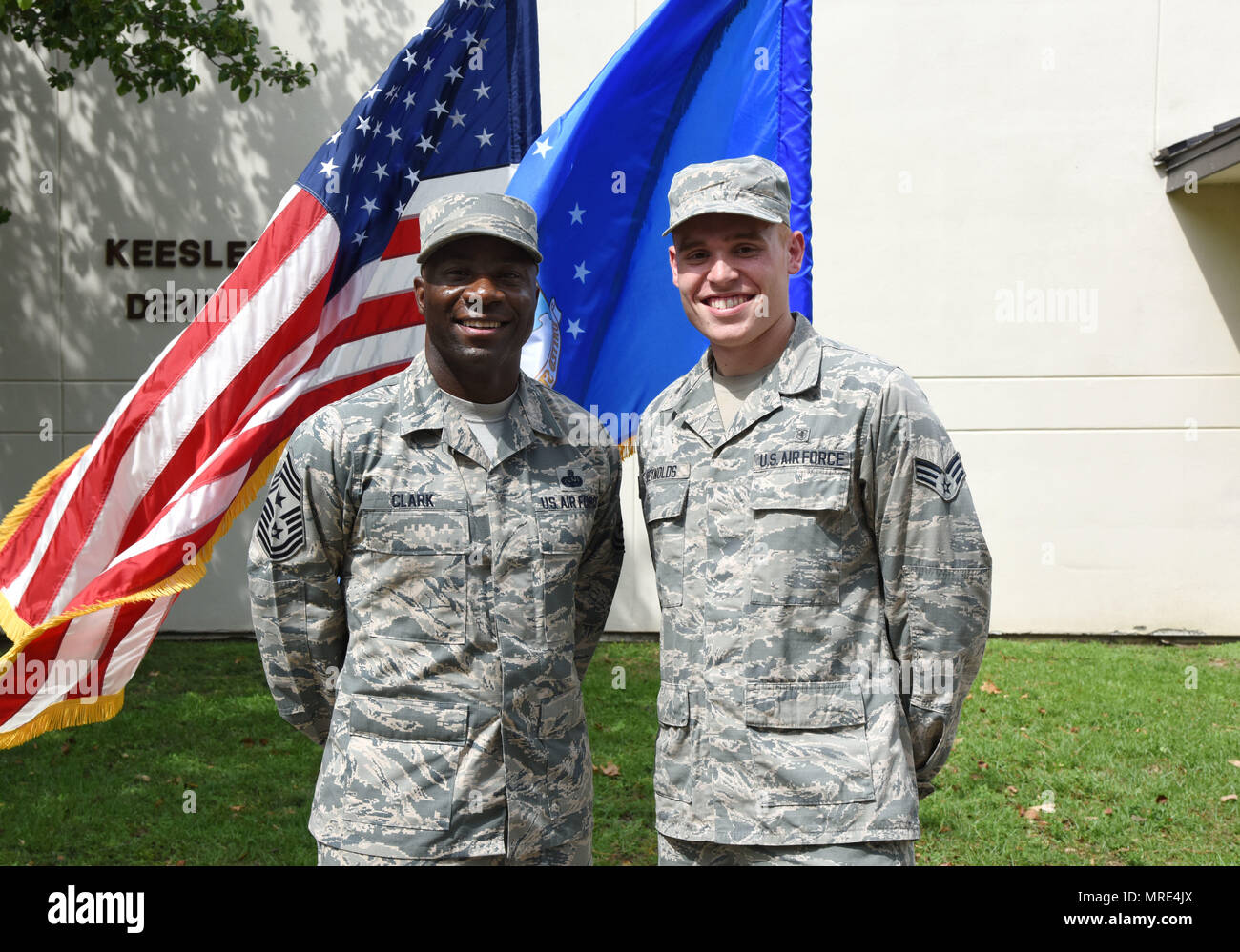 Laurice Clark pins her husband, Chief Master Sgt. Vegas Clark