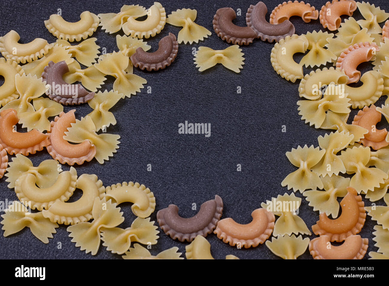 Various Types Pasta On Black Stone Stock Photo 433773259