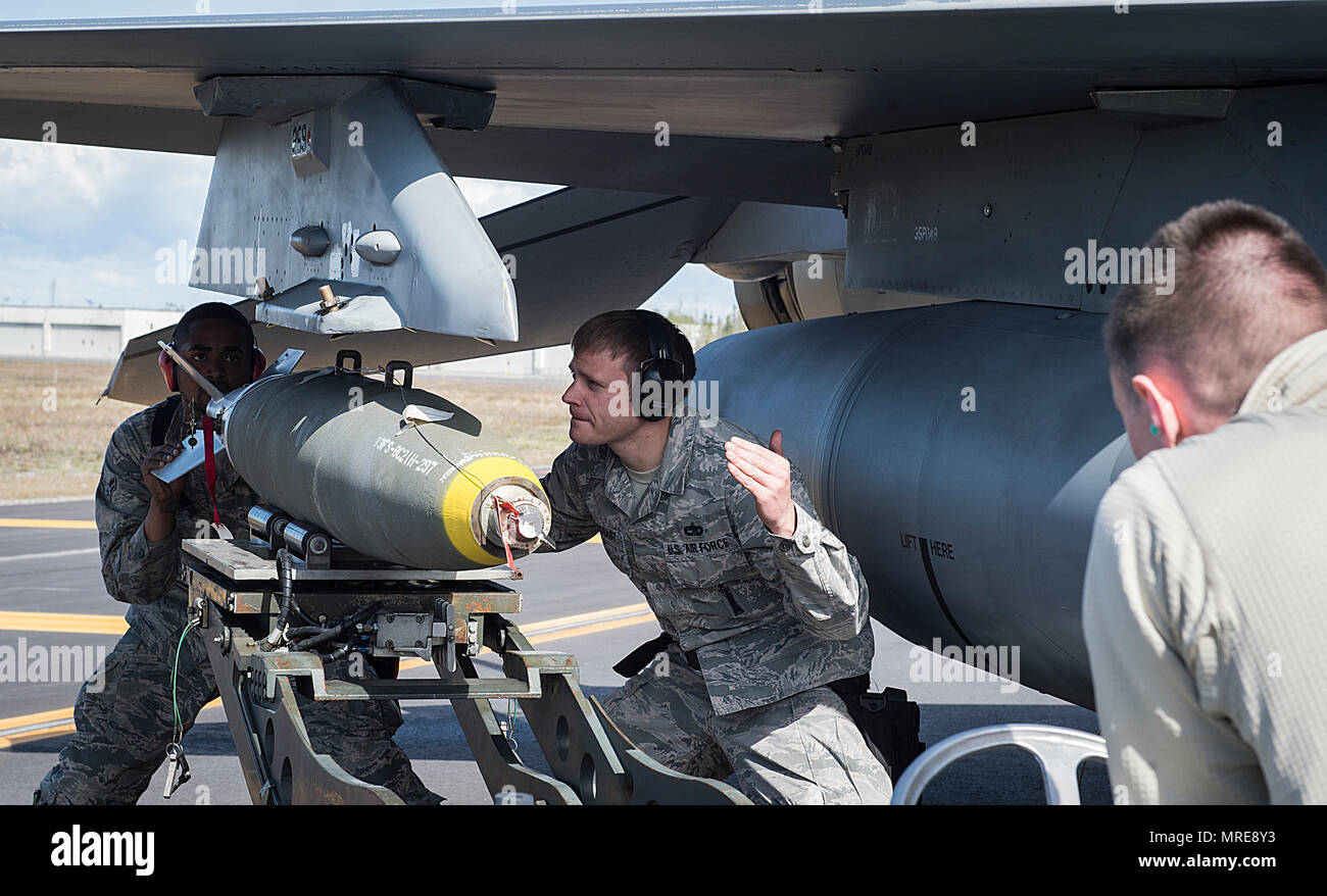U.S. Air Force Airman 1st Class Hassan Cole, left, a 13th Aircraft