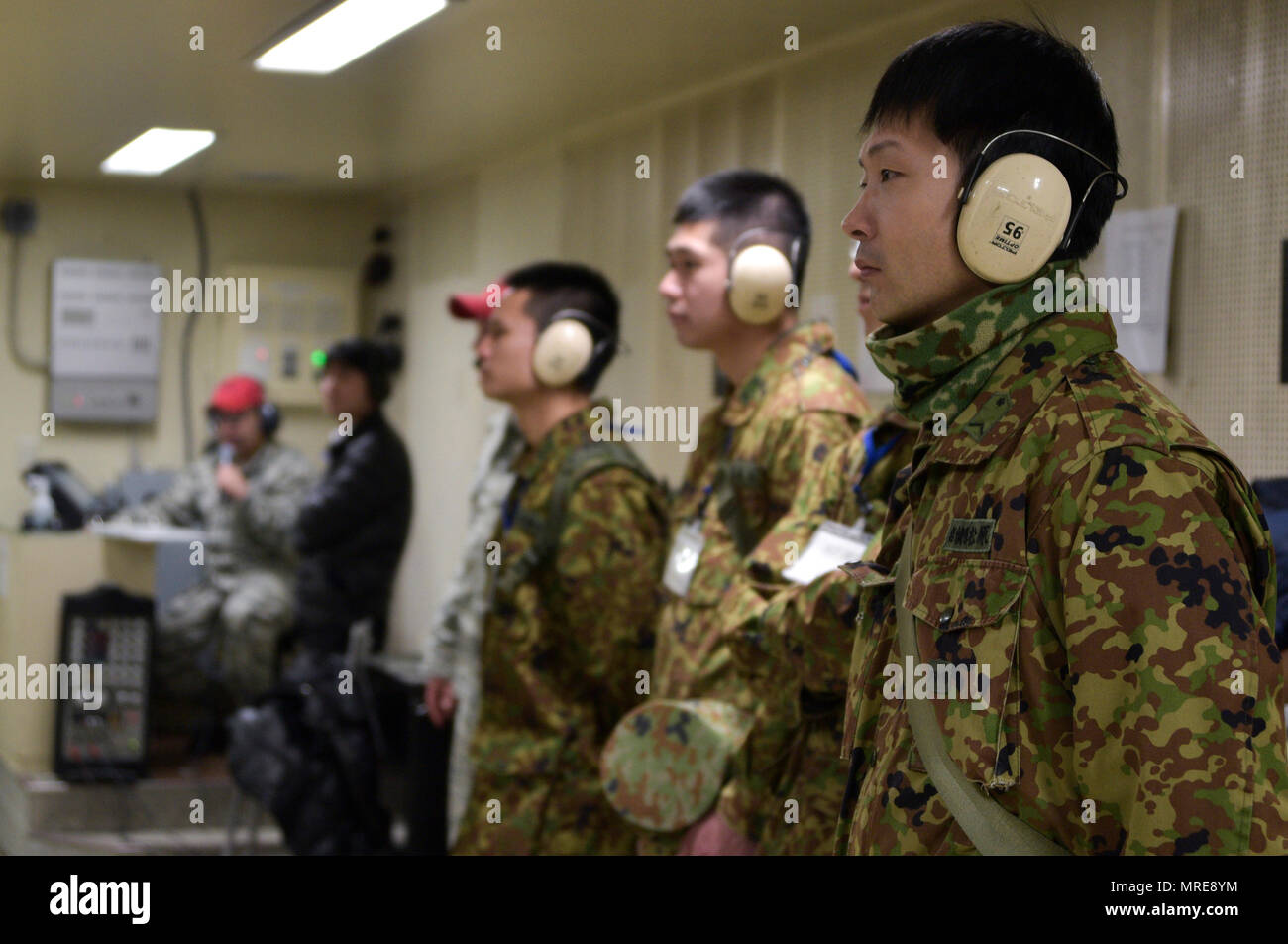 Japan Ground Self-Defense Force soldiers observe a weapons qualifying ...