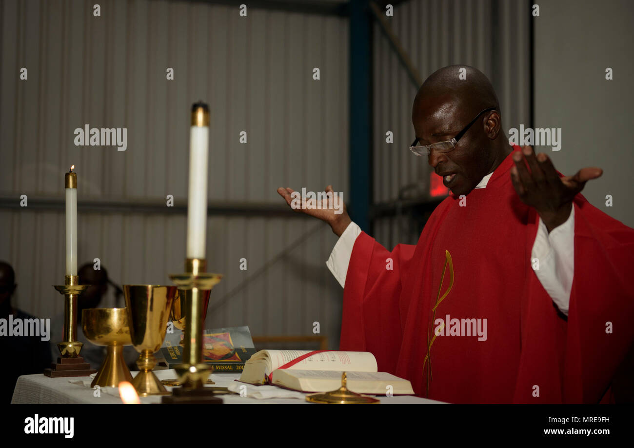 Chaplain (Capt.) John Appiah, 455th Air Expeditionary Wing, gives a sermon during an observance of the Uganda Martyrs at Bagram Airfield, Afghanistan, June 3, 2016. The Bagram Chapel team does its best to accommodate all and provides the necessary religious services for every religion. Bagram has a large population of Ugandan workers, so the Chapel team put together a religious service for them, which observed the Ugandan Martyrs. (U.S. Air Force photo by Staff Sgt. Benjamin Gonsier) Stock Photo