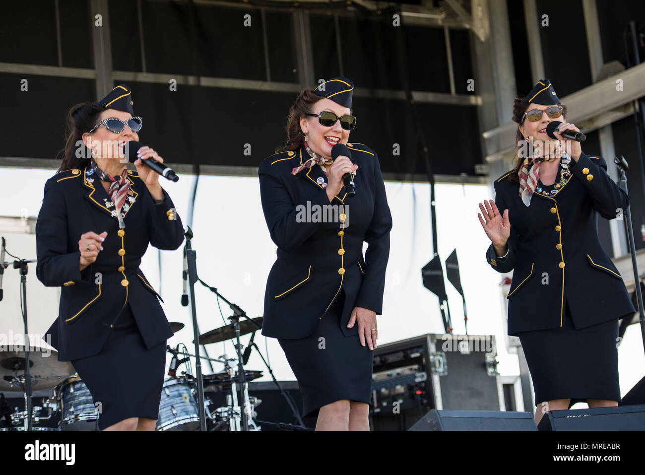 The Ladies for Liberty perform during the Scott Airshow and Open House at Scott Air Force Base, Ill., June 11, 2017. Ladies for Liberty is a singing troupe dedicated to performing the Andrew Sisters style of music through their own rendition of vocals, costumes, hairstyles, and the spirit of patriotism reminiscent of the 1940s. (U.S. Air Force photo by Tech. Sgt. Jonathan Fowler) Stock Photo
