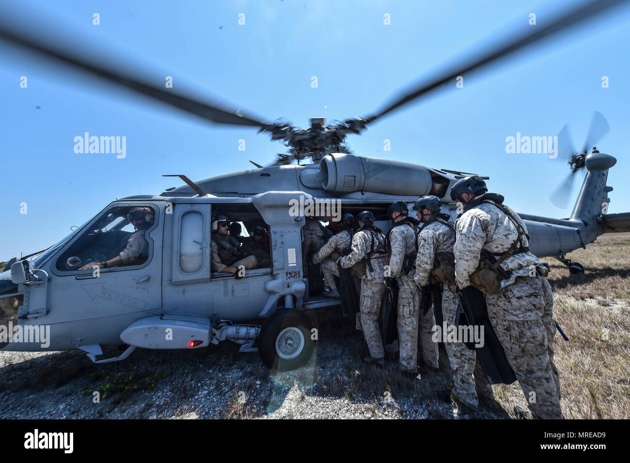 Marine Special Operations School Individual Training Course students load onto a U.S. Navy SH60