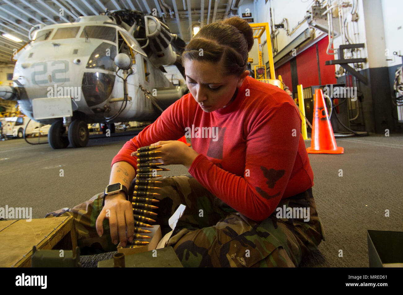 170611-N-DL434-222 PHILIPPINE SEA (June 11, 2017) Aviation Ordnanceman 3rd Class Justina Myrick, from Ft. Collins, Colo., loads an ammunition crate following a live fire exercise aboard the amphibious assault ship USS Bonhomme Richard (LHD 6). Bonhomme Richard, flagship of the Bonhomme Richard Amphibious Ready Group, is operating in the Indo-Asia-Pacific region to serve as a forward-capability for any type of contingency. (U.S. Navy photo by Mass Communication Specialist Seaman Apprentice Gavin Shields/Released) Stock Photo
