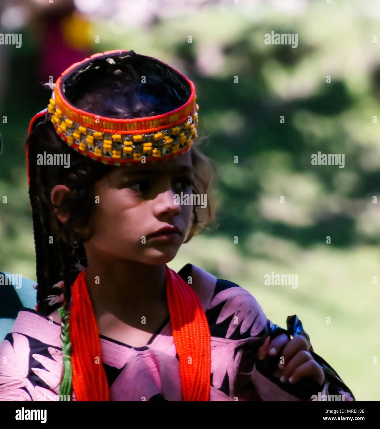 Portrait of Kalash tribe woman in national costume at Joshi fest - 14-05-2015 Bumburet, Kunar, Pakistan Stock Photo