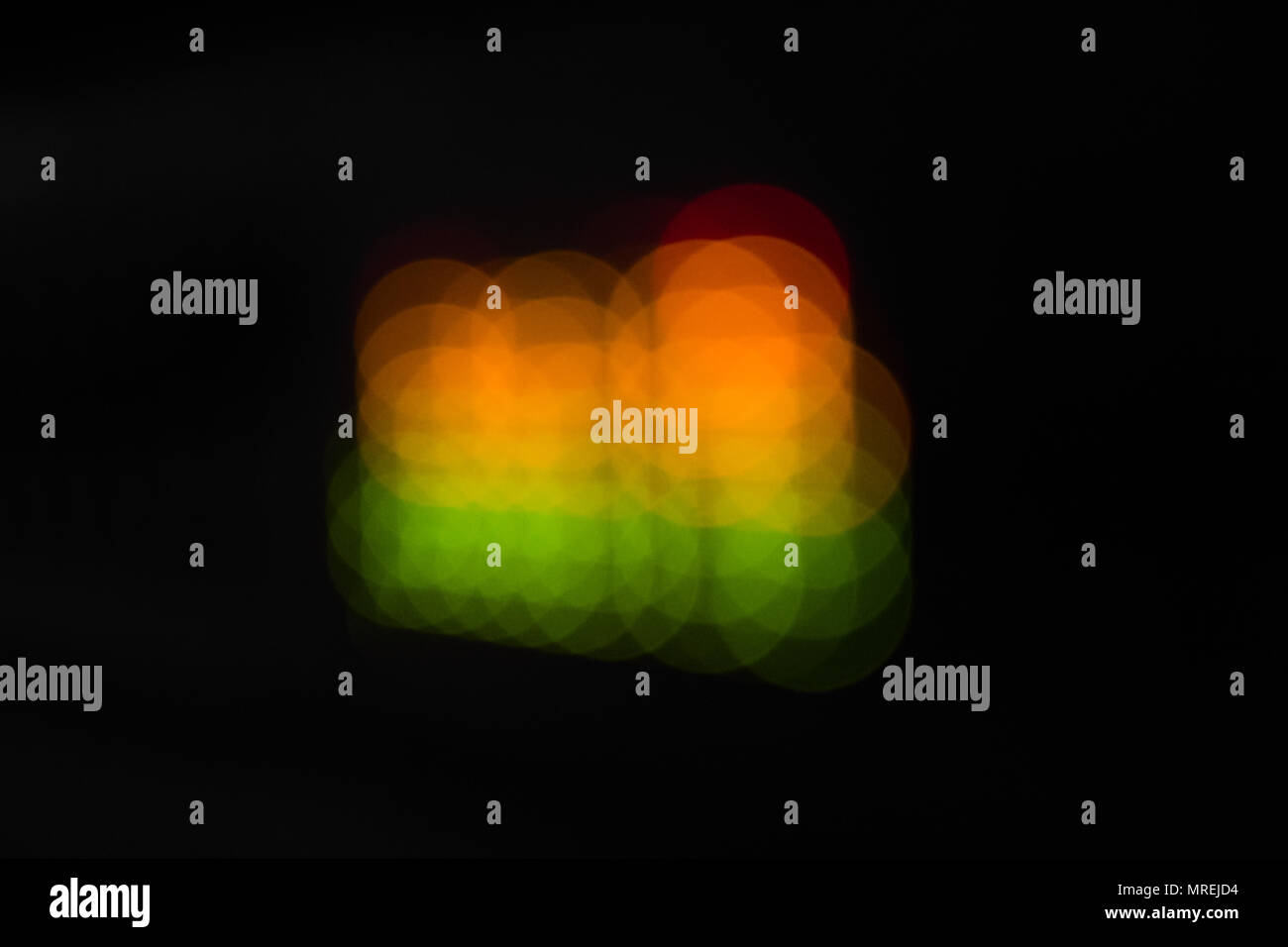 Blurred equalizer bars abstract colorful dots. In green, yellow