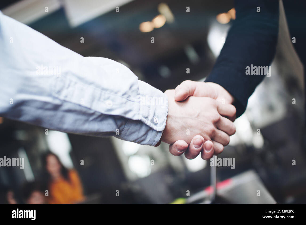 Two business partners shake hands after a successful deal. Close up view of business partnership handshake Stock Photo