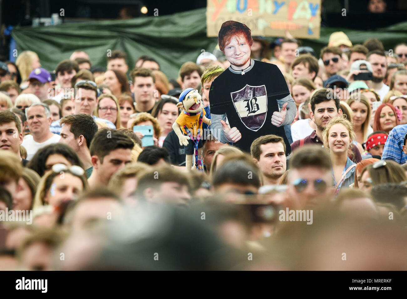 An Ed Sheeran cardboard cutout in the crowd as he performs during the