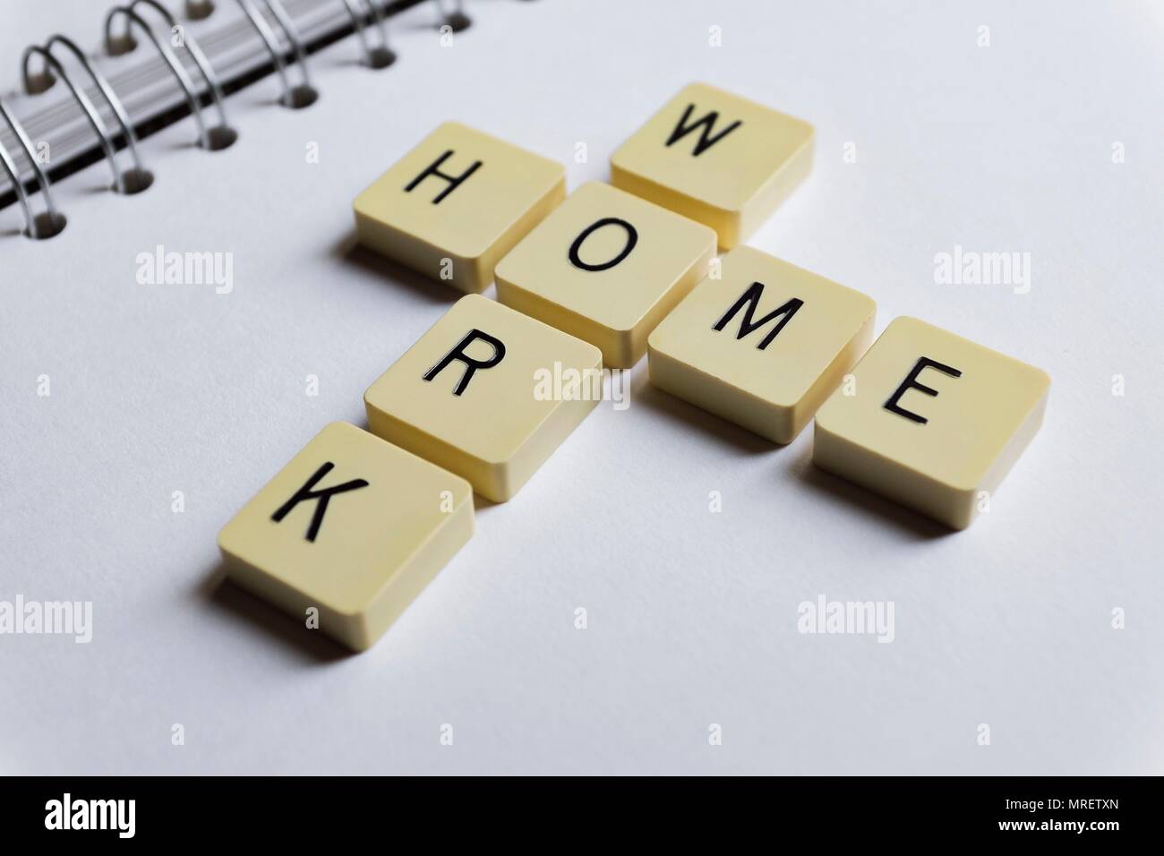 Tiles with letters spelling the words home and work. Stock Photo