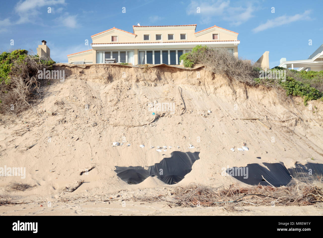 Eroding sand dunes caused by the removal of vegetation, Sedgefield, Western Cape, South Africa. Stock Photo