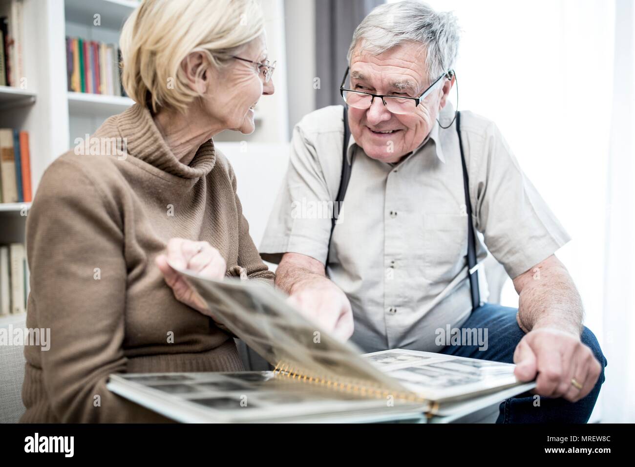 Senior couple looking at photo album. Stock Photo