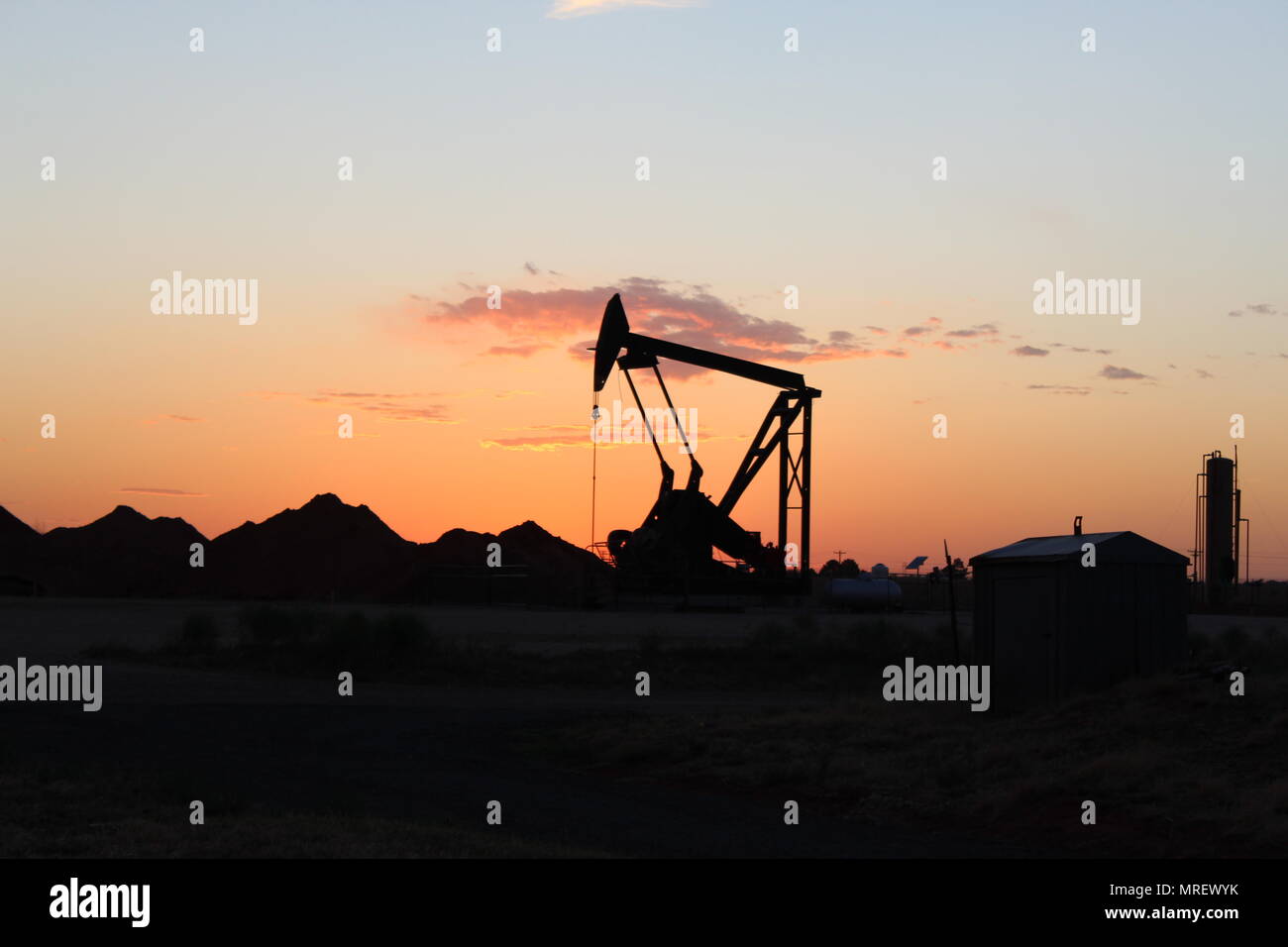 Texas pump jack at sunset Stock Photo Alamy