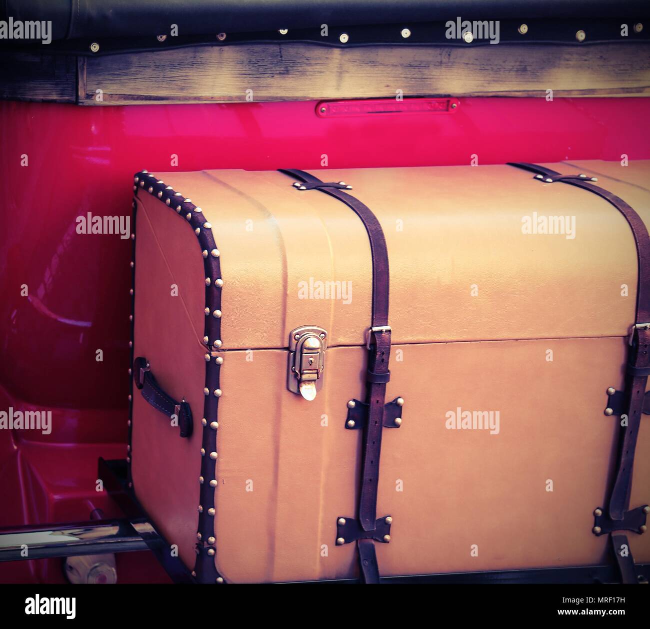Antique vintage trunk attached to a vintage red car Stock Photo - Alamy
