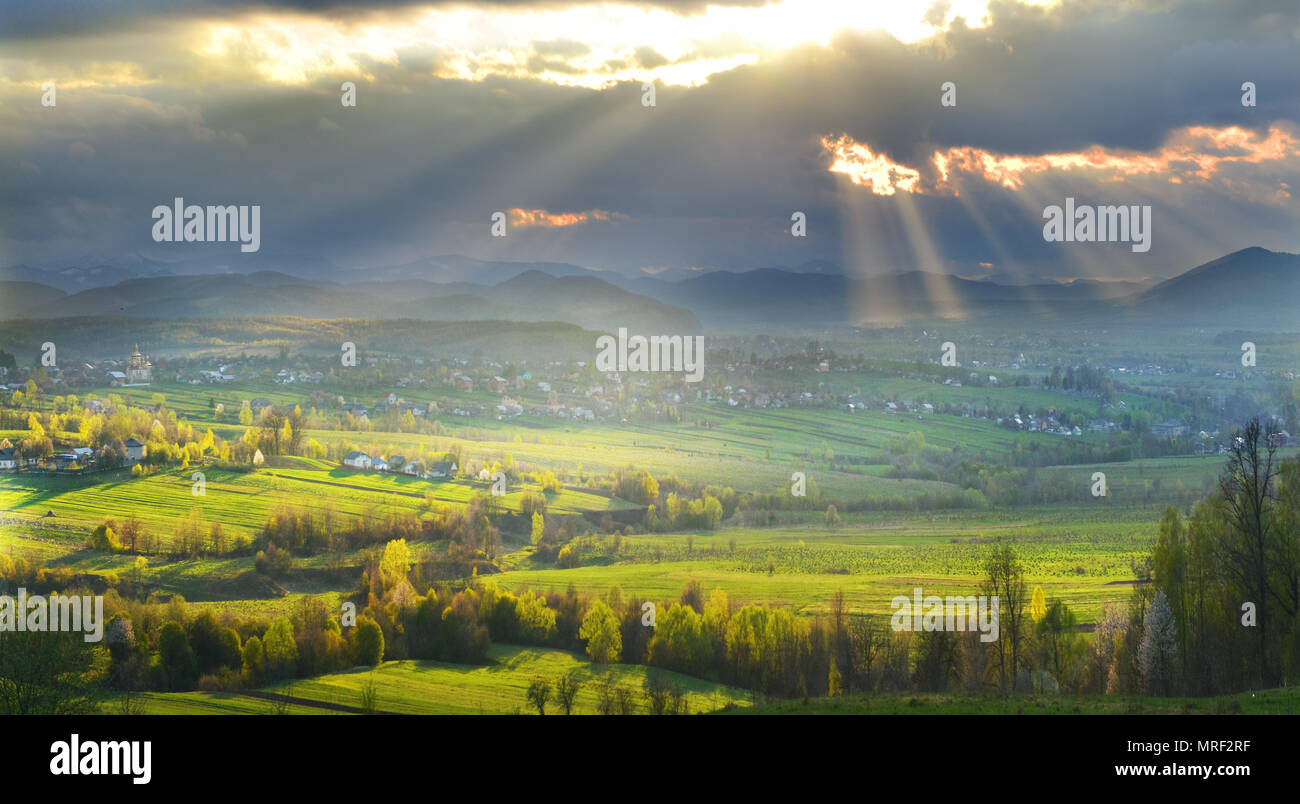 Rural landscape with incident sunrays. Stock Photo