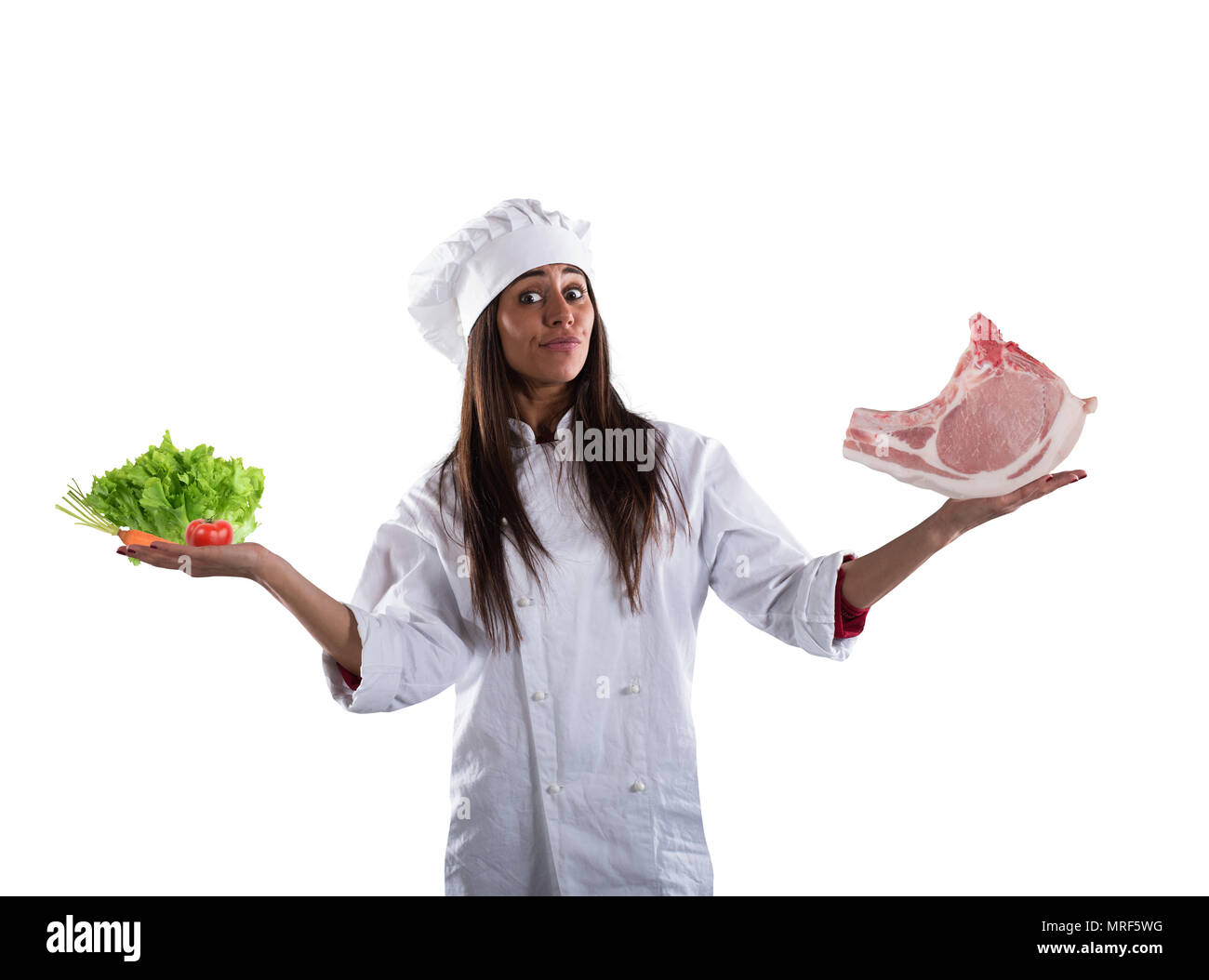 Chef undecided between fresh salad or meat steak. concept of vegetarian Stock Photo