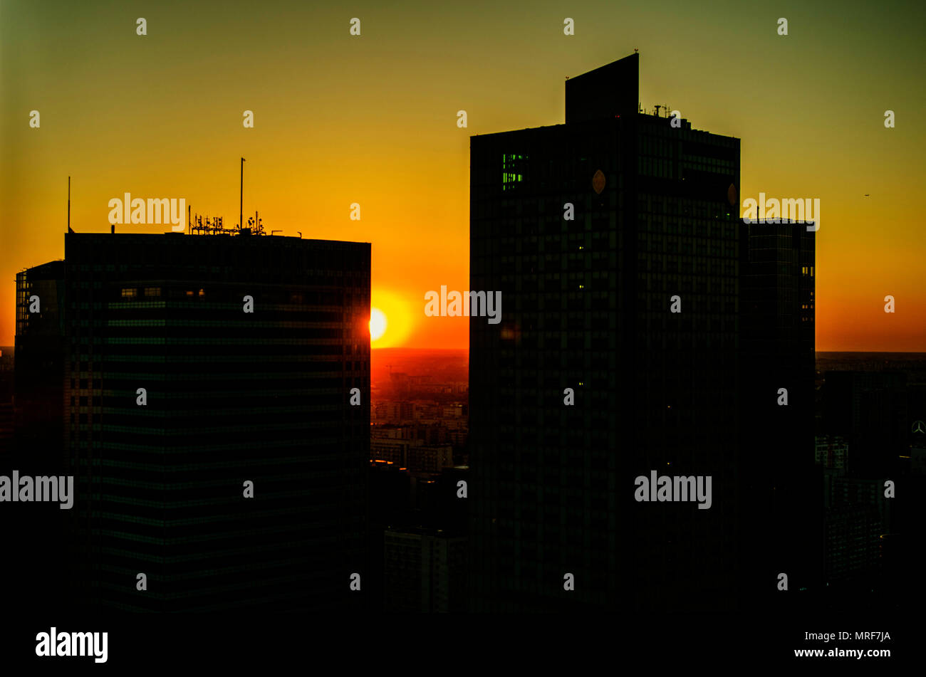 Silhouette of buildings against sunset backdrop hi-res stock ...