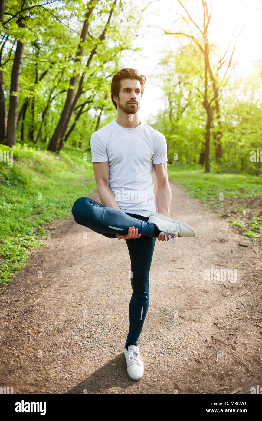 Young fitness man stretching hi-res stock photography and images - Alamy