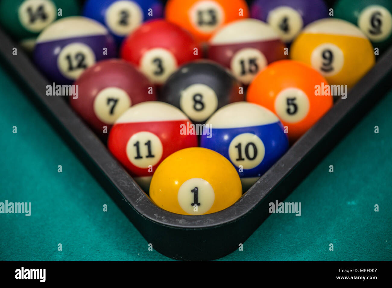 Billiard balls arranged in a triangle viewed from above Stock Photo