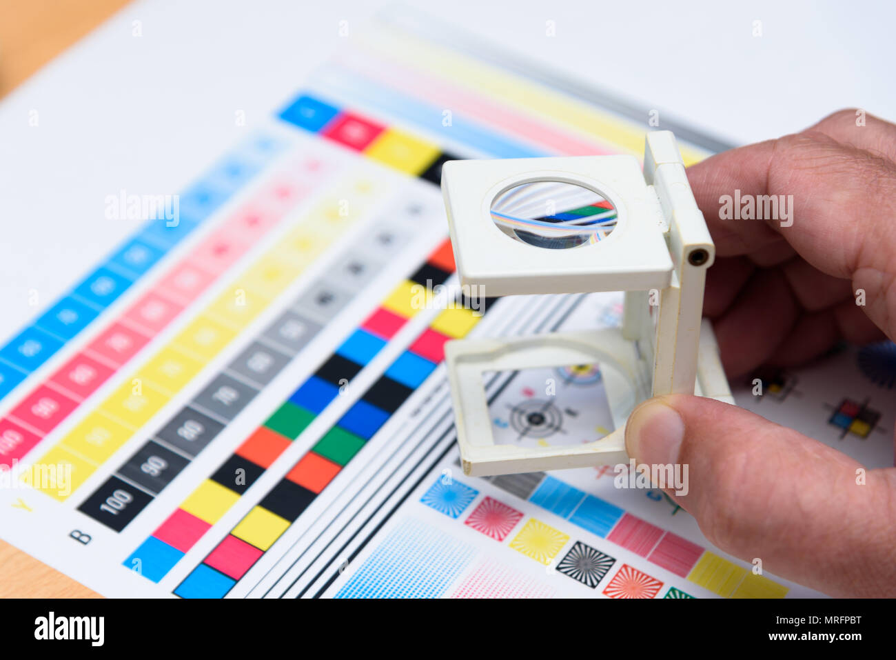 Printing Thread Counter Being Used by Male Hand Measurement Color Management Industry Object Stock Photo