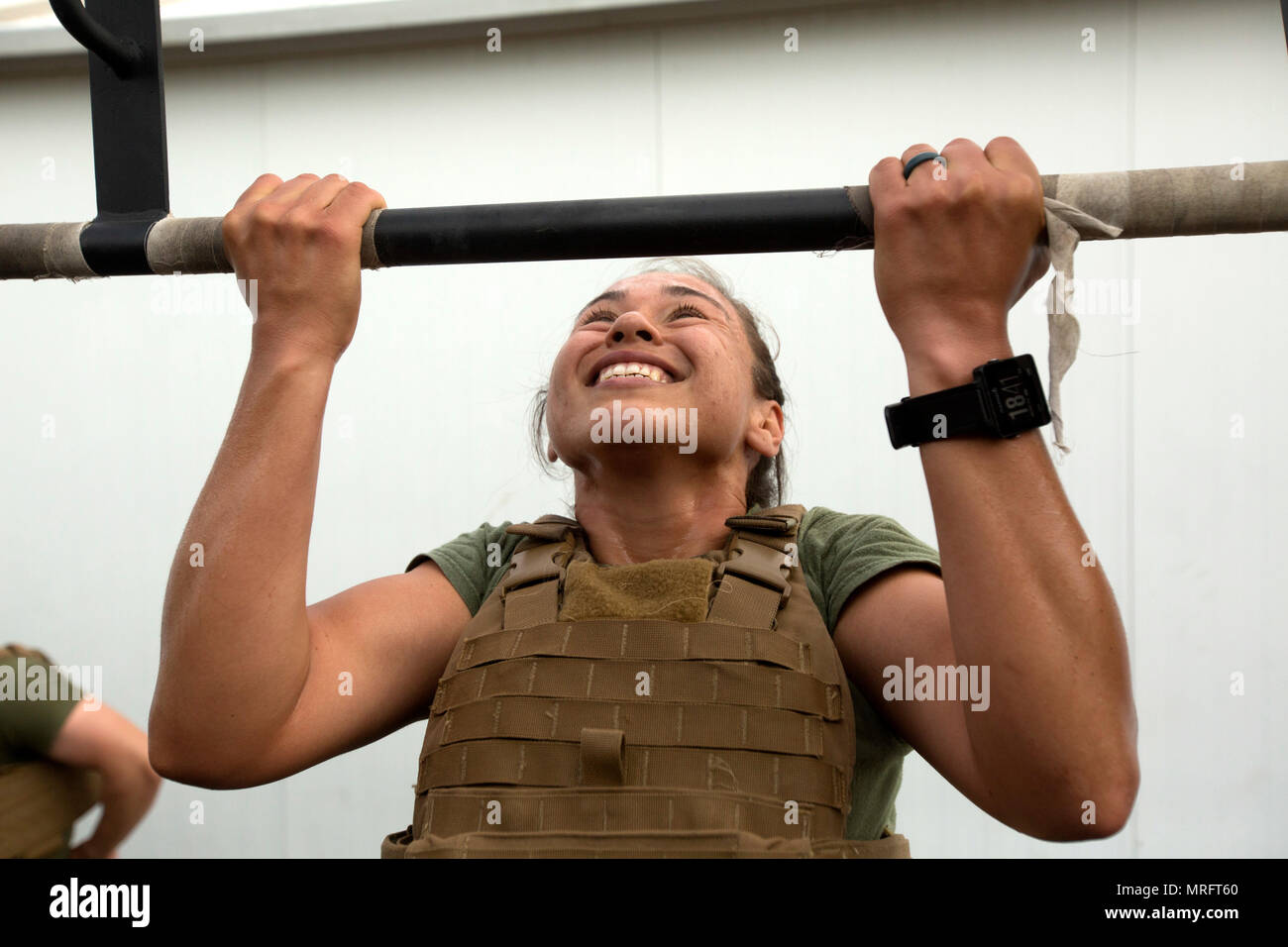 Corporal Dana Rodriguez a postal clerk assigned to Special Purpose Marine Air Ground Task Force Crisis Response Africa combat logistics detachment performs pull ups as part of the 2017 Memorial Day Mu...