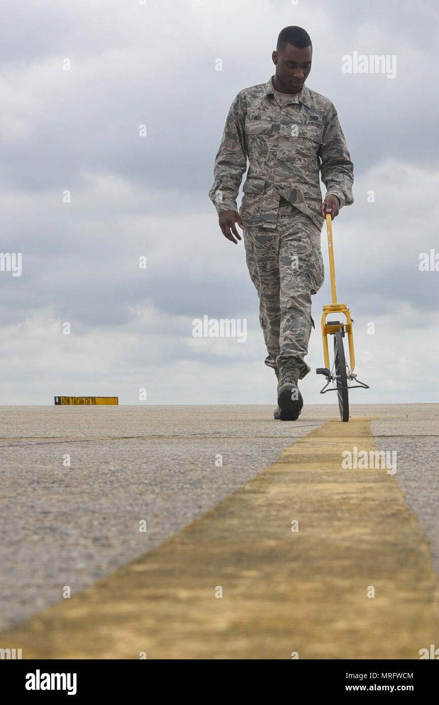 An 89th Operations Support Squadron airfield manager measures ...